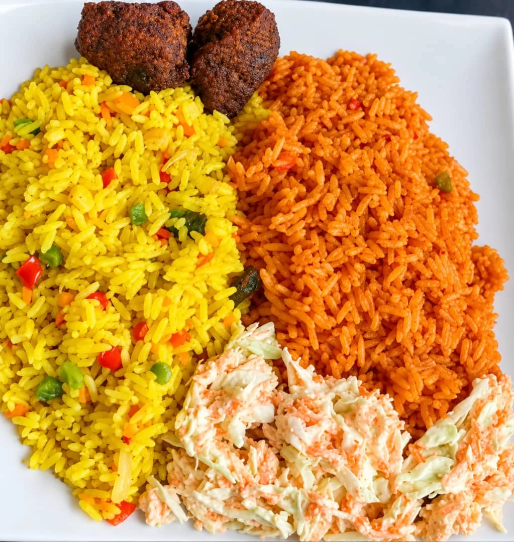 Sia’s Spice & More rice platter with jollof rice, yellow rice and sides